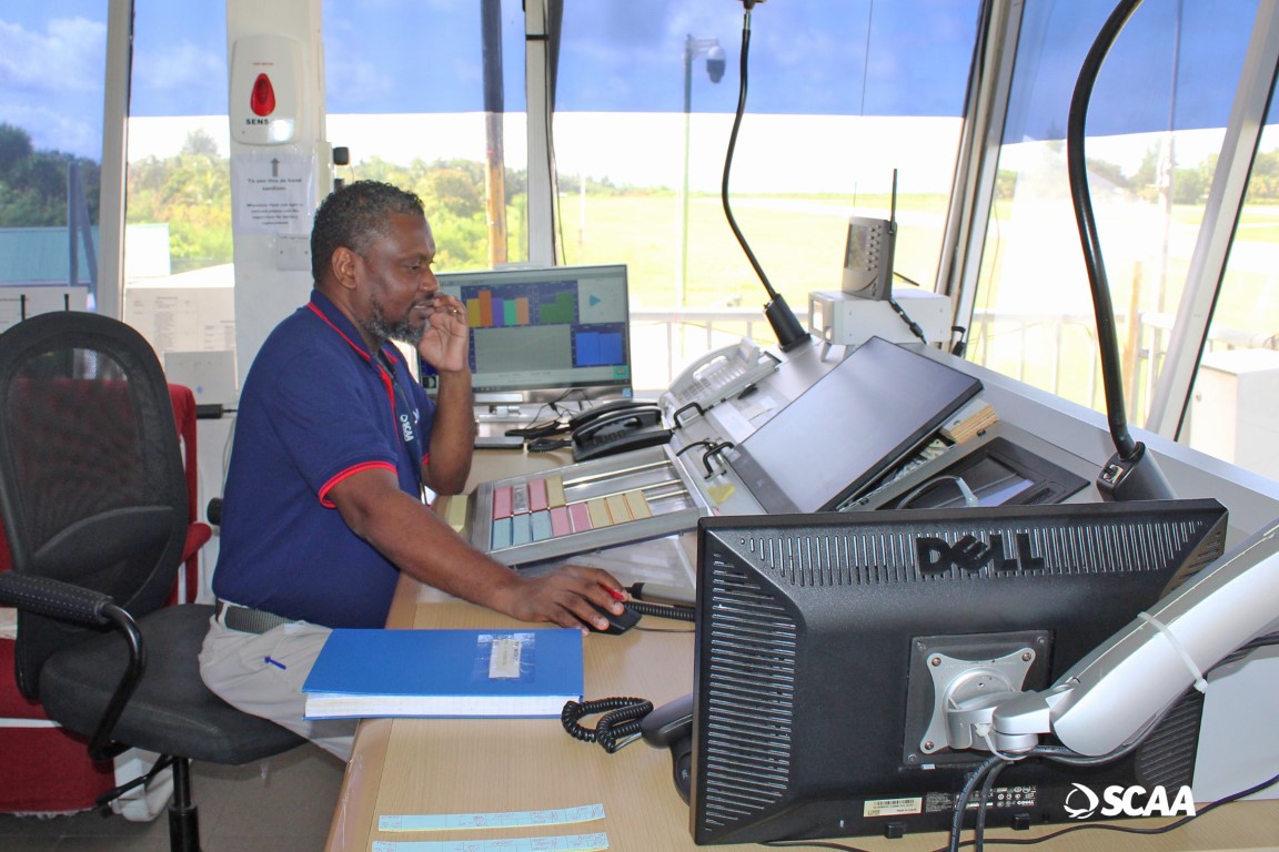 An Air Traffic Controller at work in the control tower on Praslin